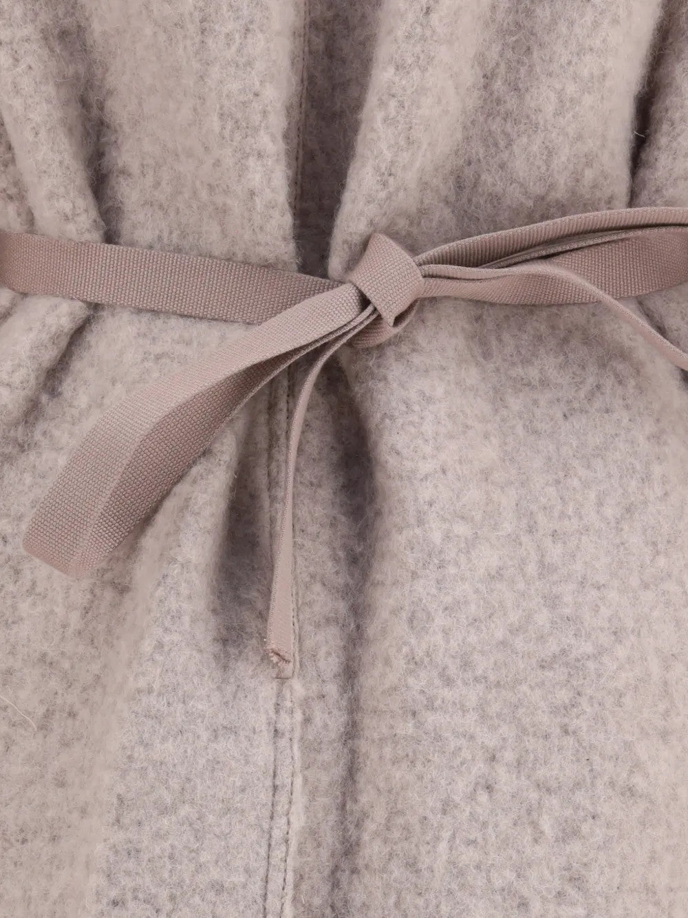 Close up of Tan jacket, showing texture of the 100% wool fabric