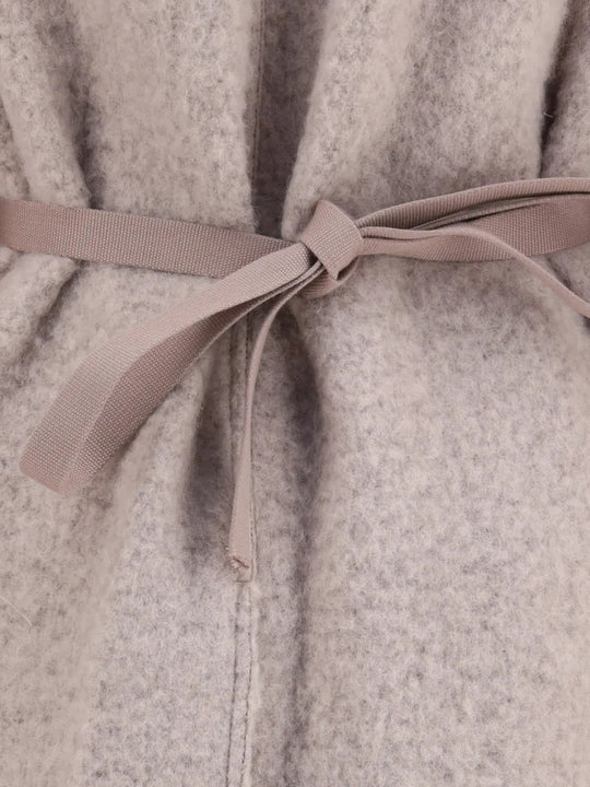 Close up of Tan jacket, showing texture of the 100% wool fabric