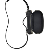 Close up of black bags, showing texture of the leather fabric