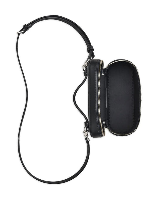 Close up of black bags, showing texture of the leather fabric