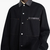 Black jacket worn by a person, showing the jacket's fit