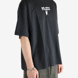 Black shirt worn by a person, showing the shirt's fit