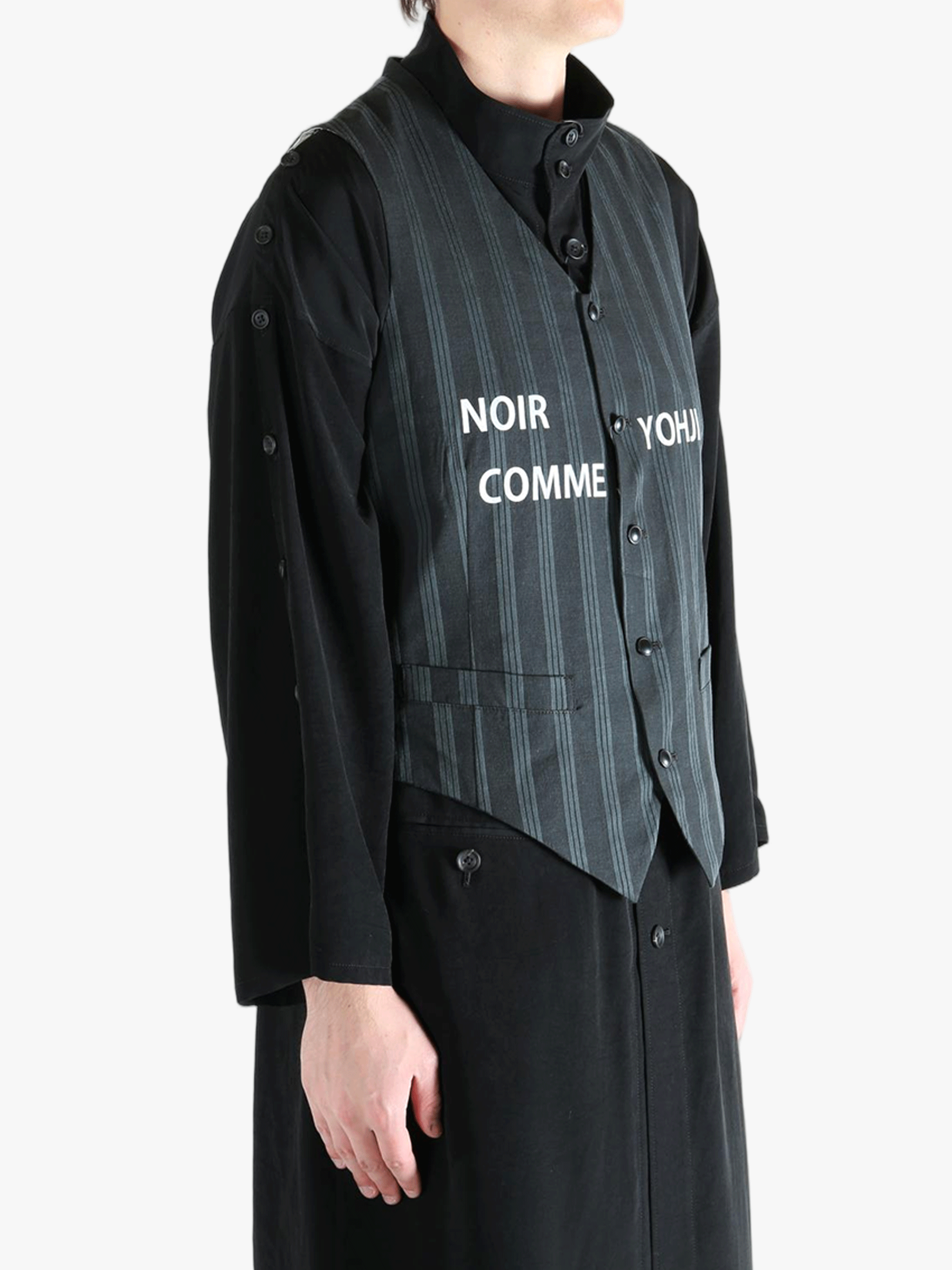 Black vest worn by a person, showing the vest's fit