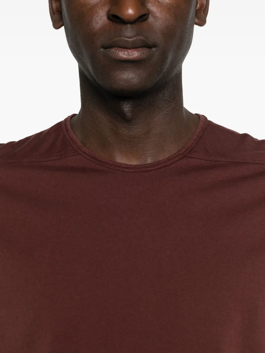 Close up of the red t-shirt, showing texture of the cotton fabric