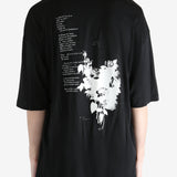 Black T-shirt worn by a person, showing the T-shirt fit