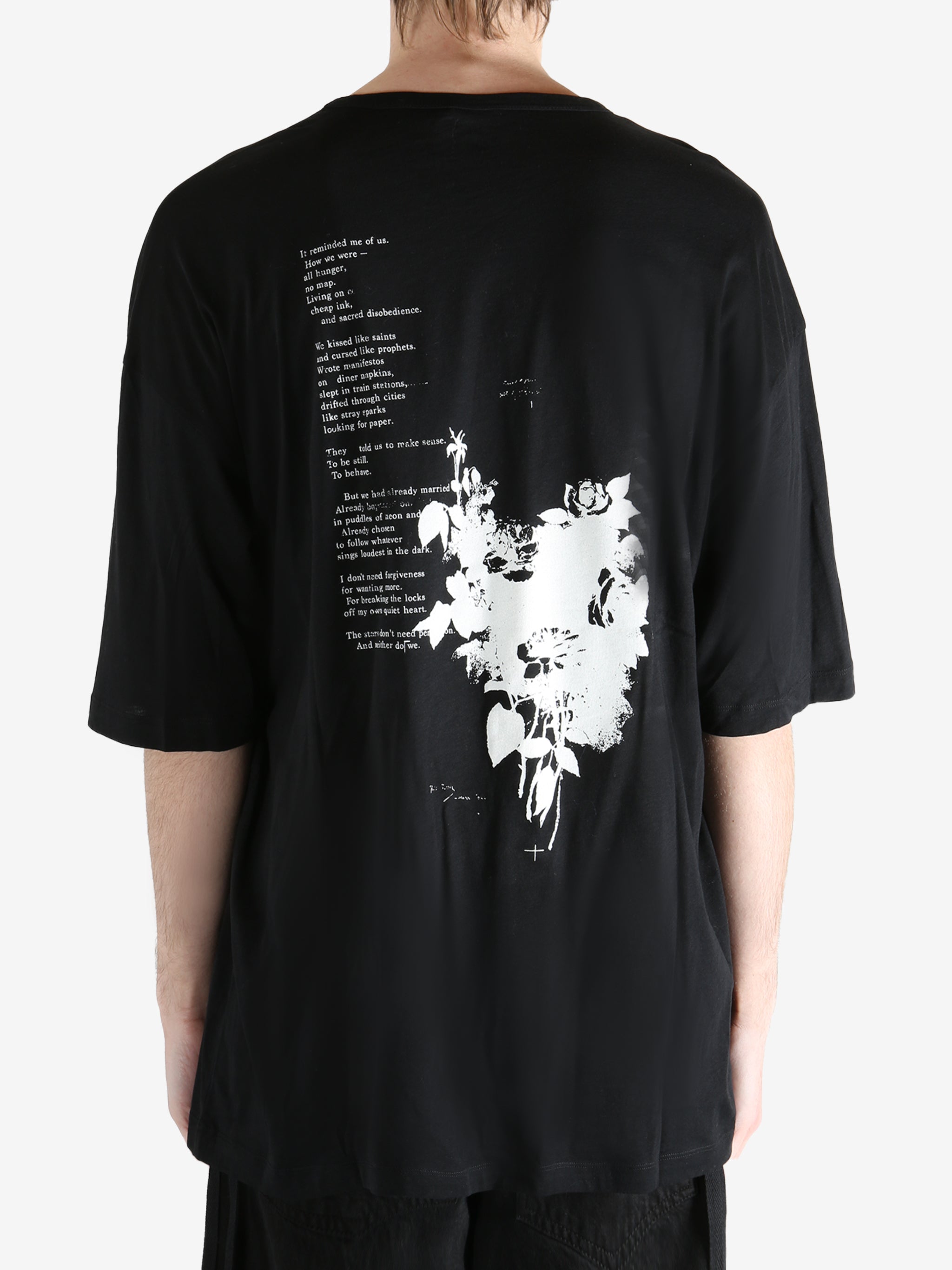 Black T-shirt worn by a person, showing the T-shirt fit