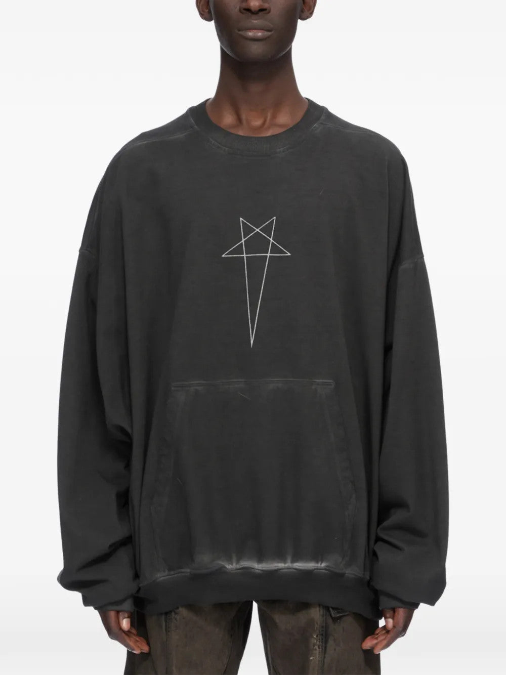 Black t-shirt worn by a person, showing the t-shirt fit