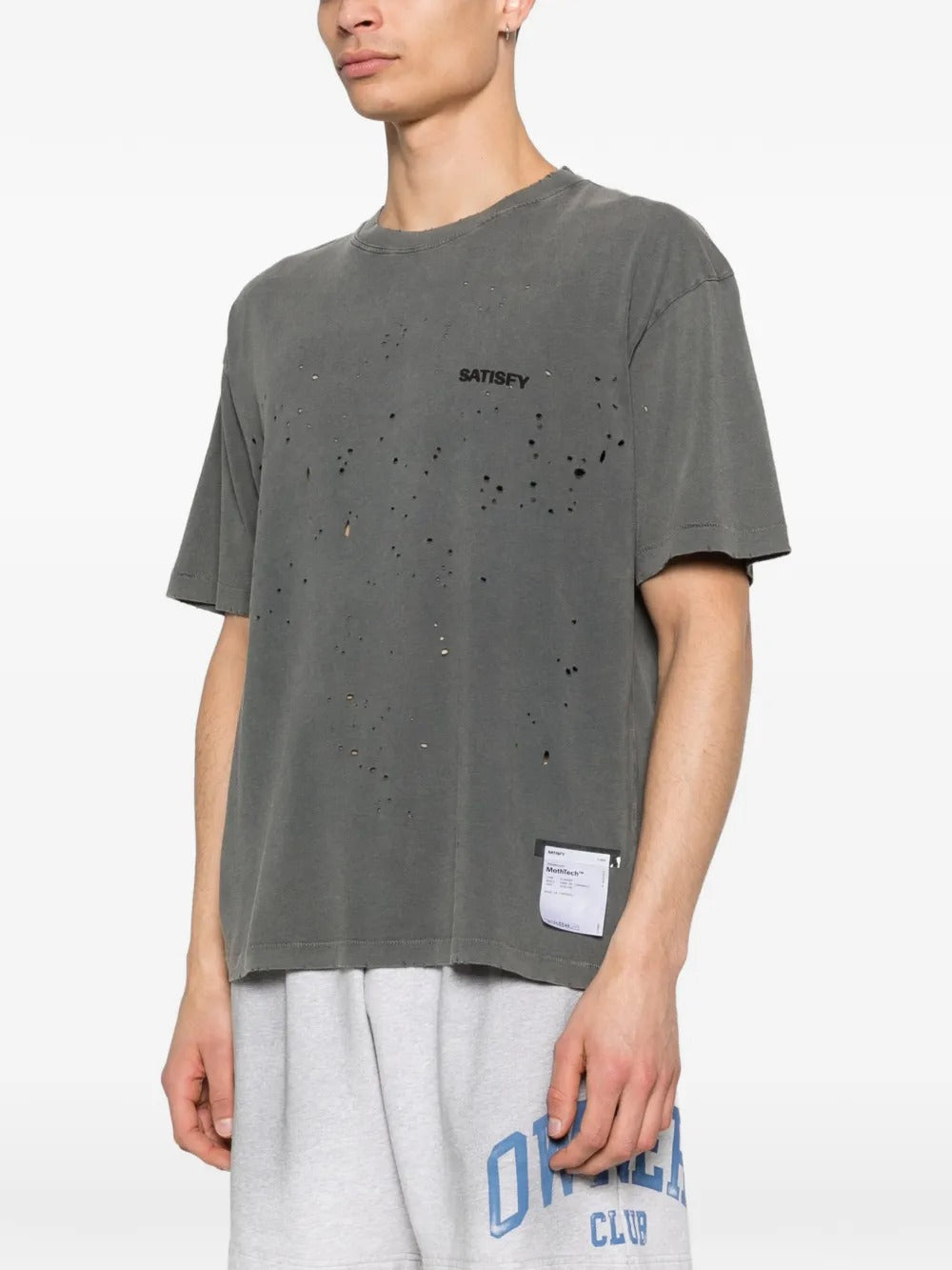 Black t-shirt worn by a person, showing the shirt's fit