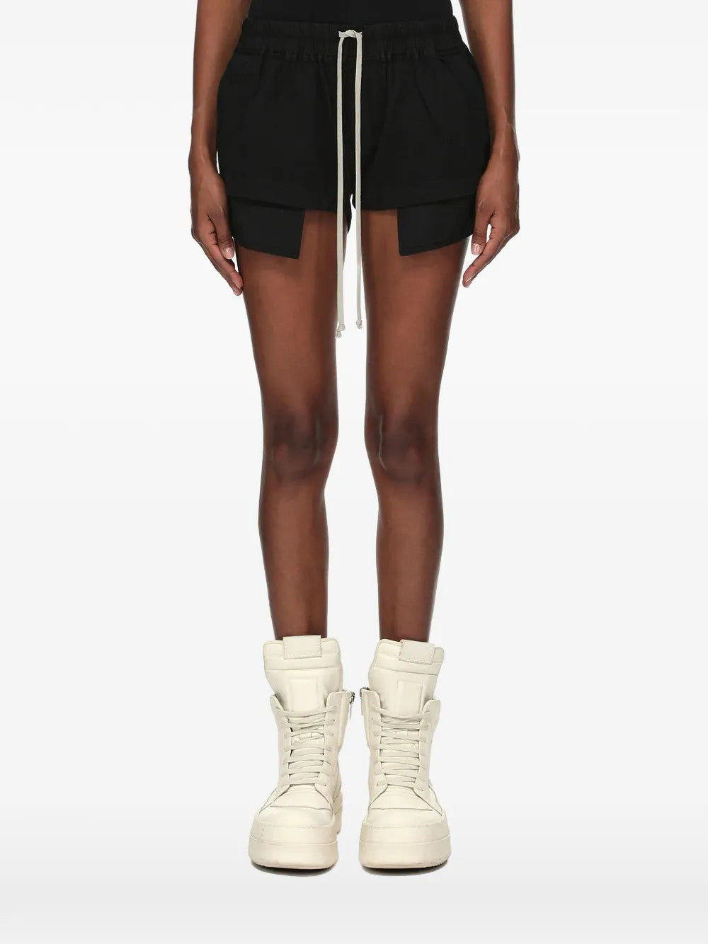 Black shorts worn by a person, showing the shorts fit