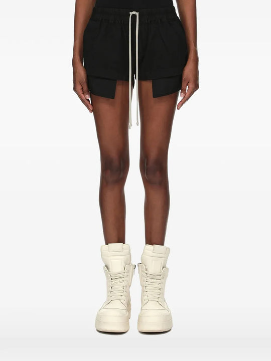 Black shorts worn by a person, showing the shorts fit