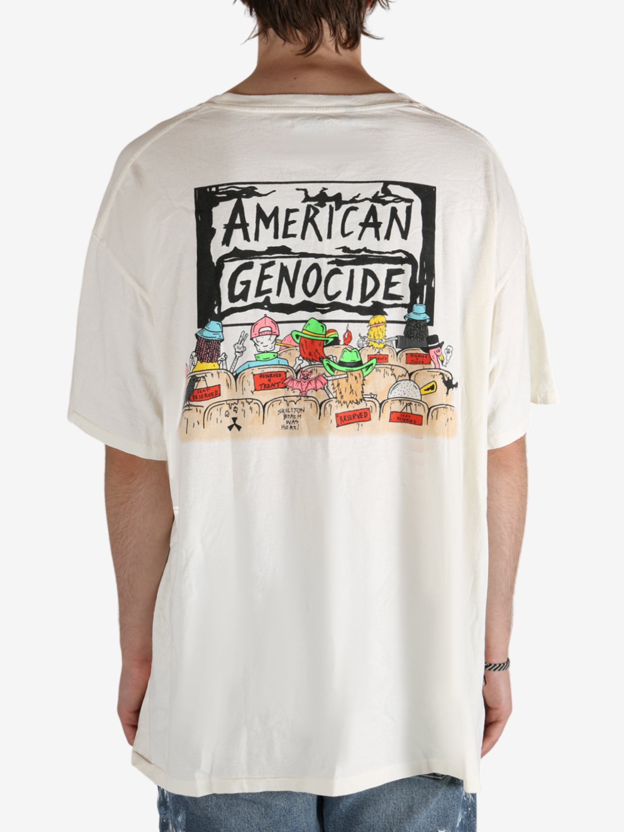 White t-shirt worn by a person, showing the shirt's fit