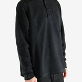 Black sweatshirt worn by a person, showing the sweatshirt's fit