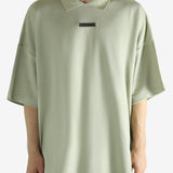 Green shirt worn by a person, showing the shirt's fit