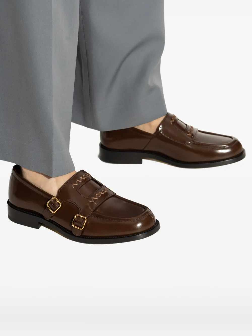 Brown shoes worn by a person, showing the shoes fit