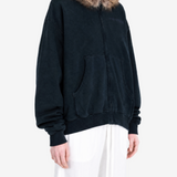 Navy hoodie worn by a person, showing the hoodie fit