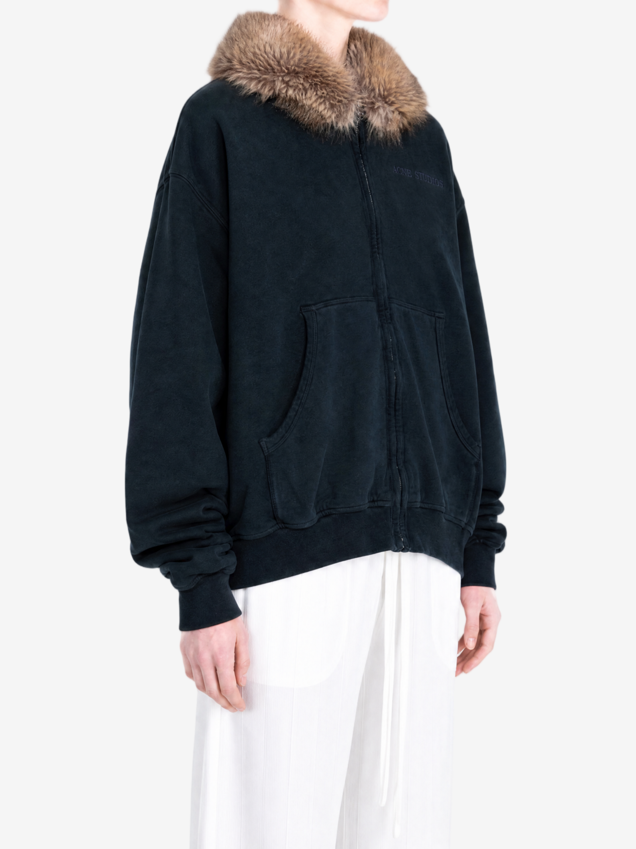 Navy hoodie worn by a person, showing the hoodie fit