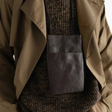Brown bag worn by a person, showing the bag fit