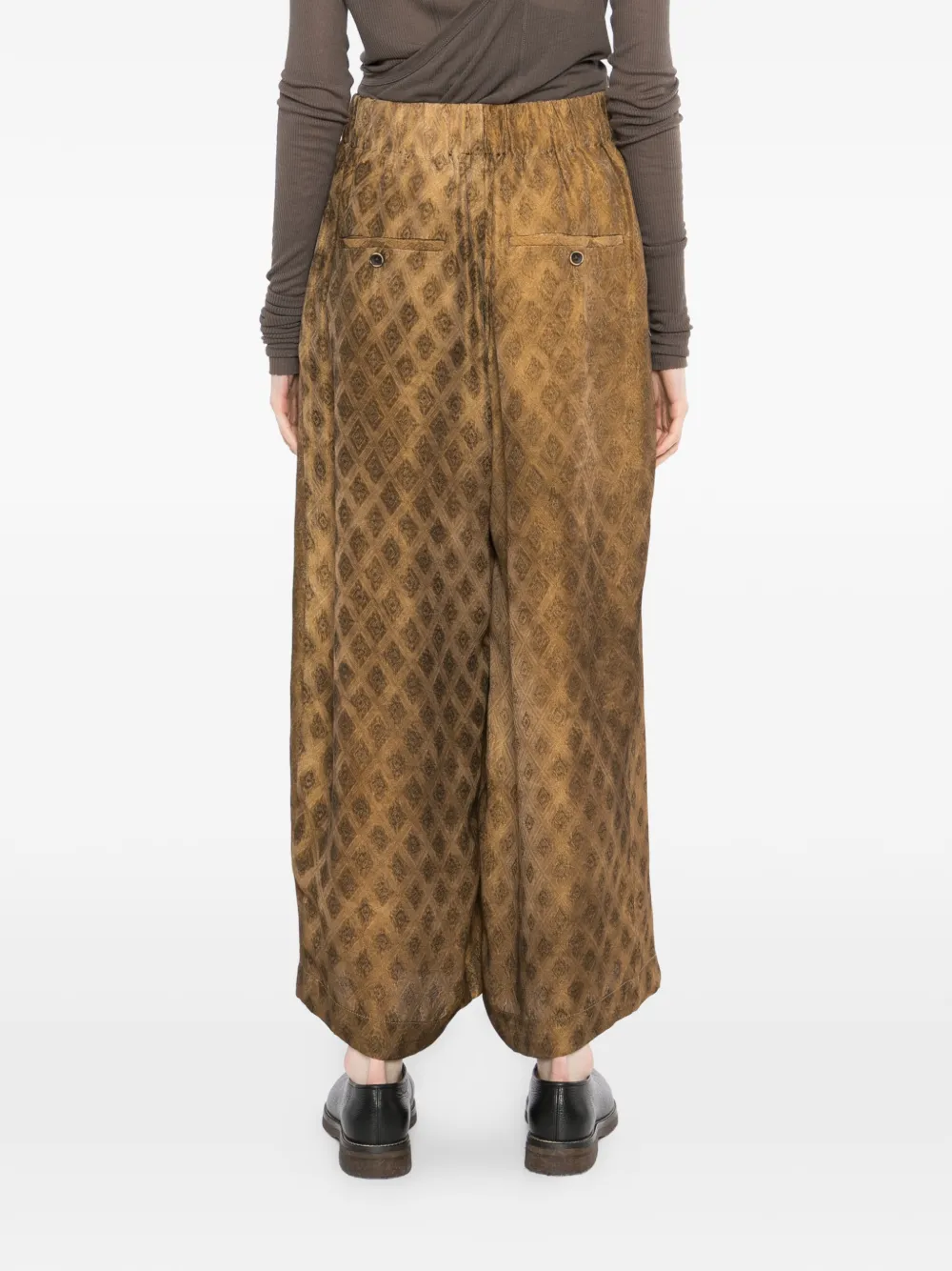 Brown pants worn by a person, showing the pants fit