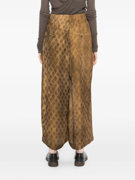 Brown pants worn by a person, showing the pants fit