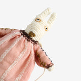 Close up of pink doll,showing texture of the wool fabric