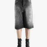 Black shorts worn by a person, showing the shorts's fit