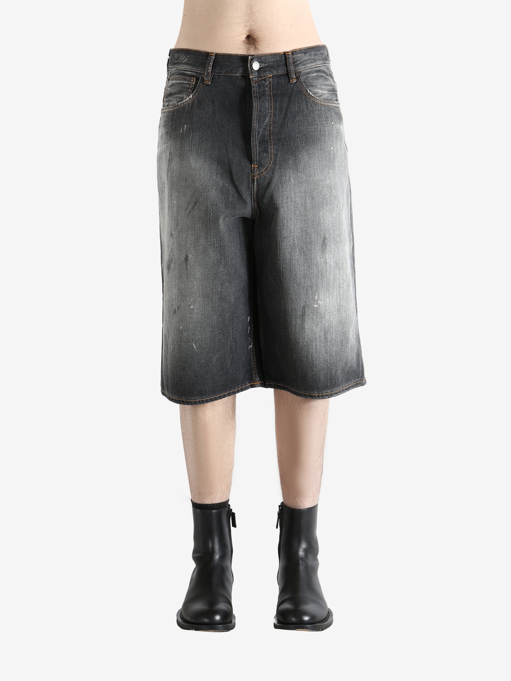 Black shorts worn by a person, showing the shorts's fit