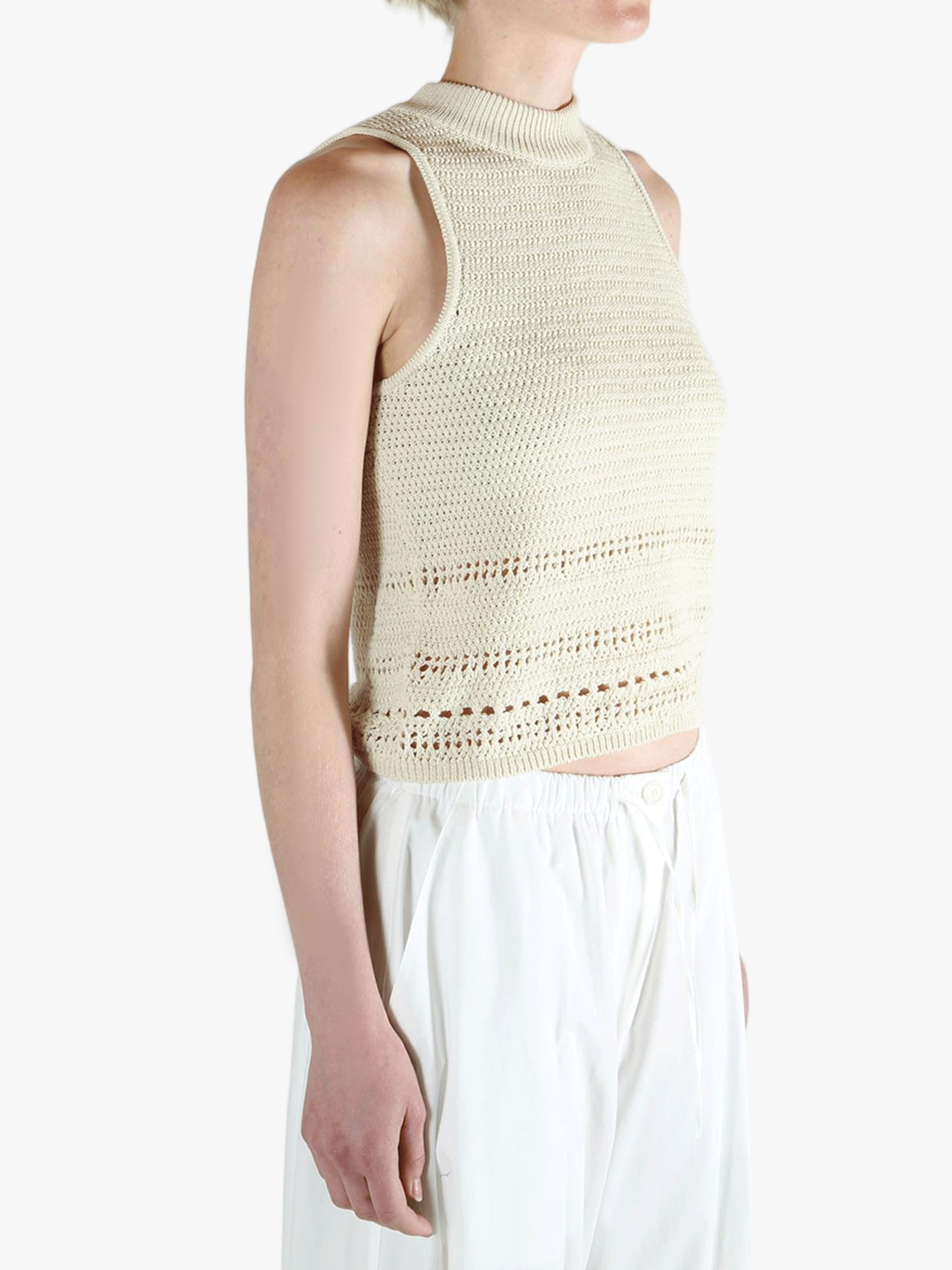 White vest worn by a person, showing the vest's fit