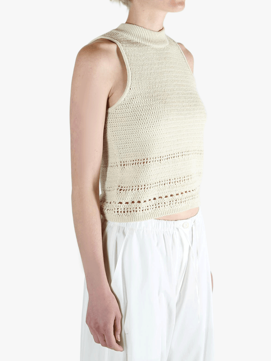 White vest worn by a person, showing the vest's fit