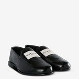 Black loafer, side view