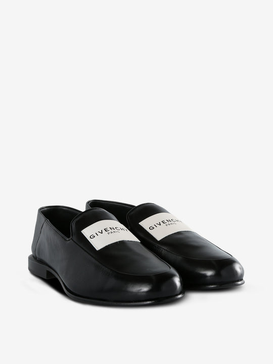 Black loafer, side view