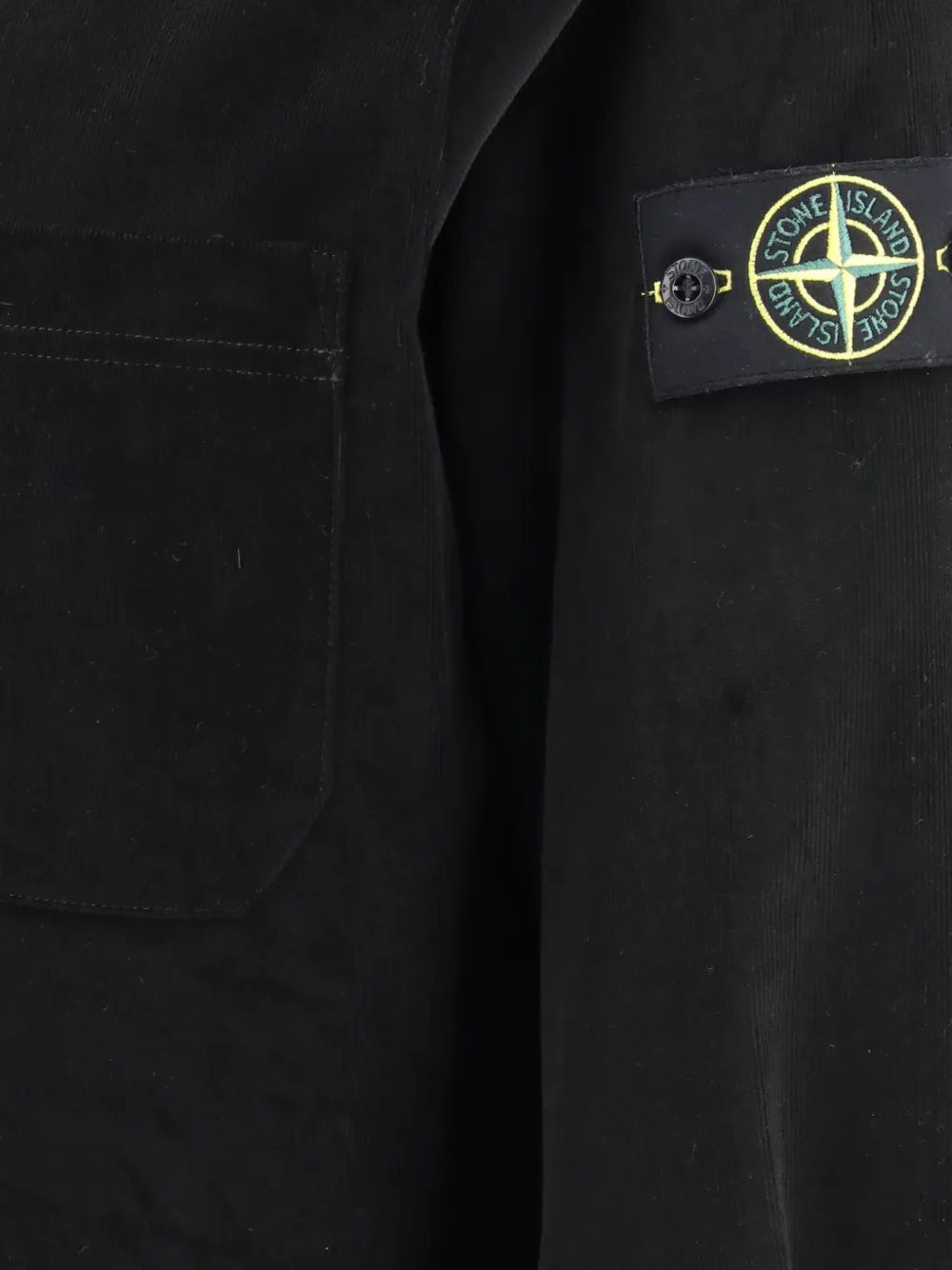 Close up of Black shirt, showing texture of the cotton fabric