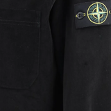 Close up of Black shirt, showing texture of the cotton fabric