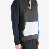 Color-blocked hoodie worn by a person, showing the hoodie fit