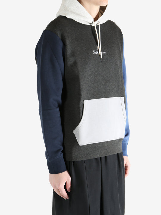 Color-blocked hoodie worn by a person, showing the hoodie fit