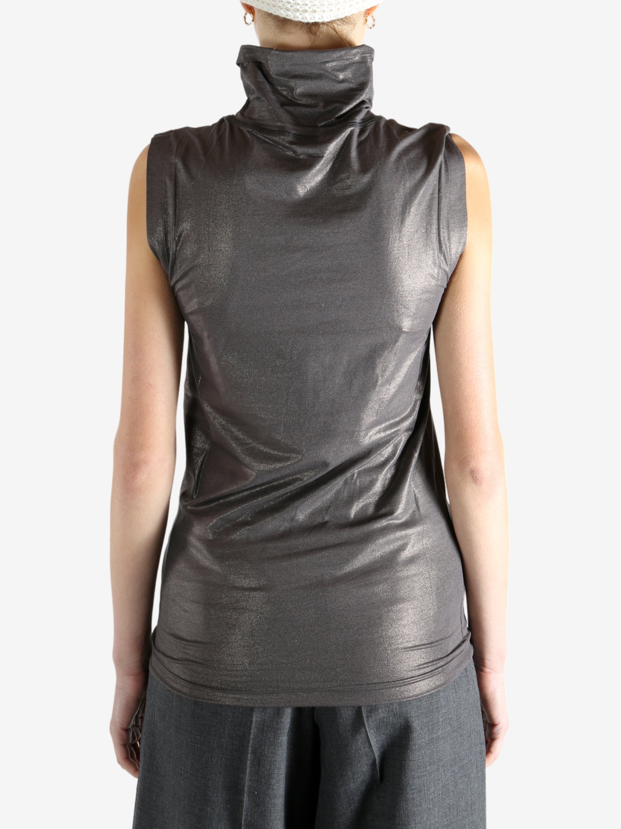 Grey tops worn by a person, showing the tops fit