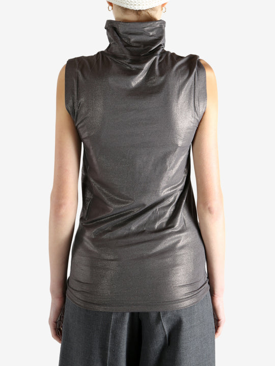 Grey tops worn by a person, showing the tops fit