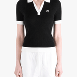 Black shirt worn by a person, showing the shirt fit