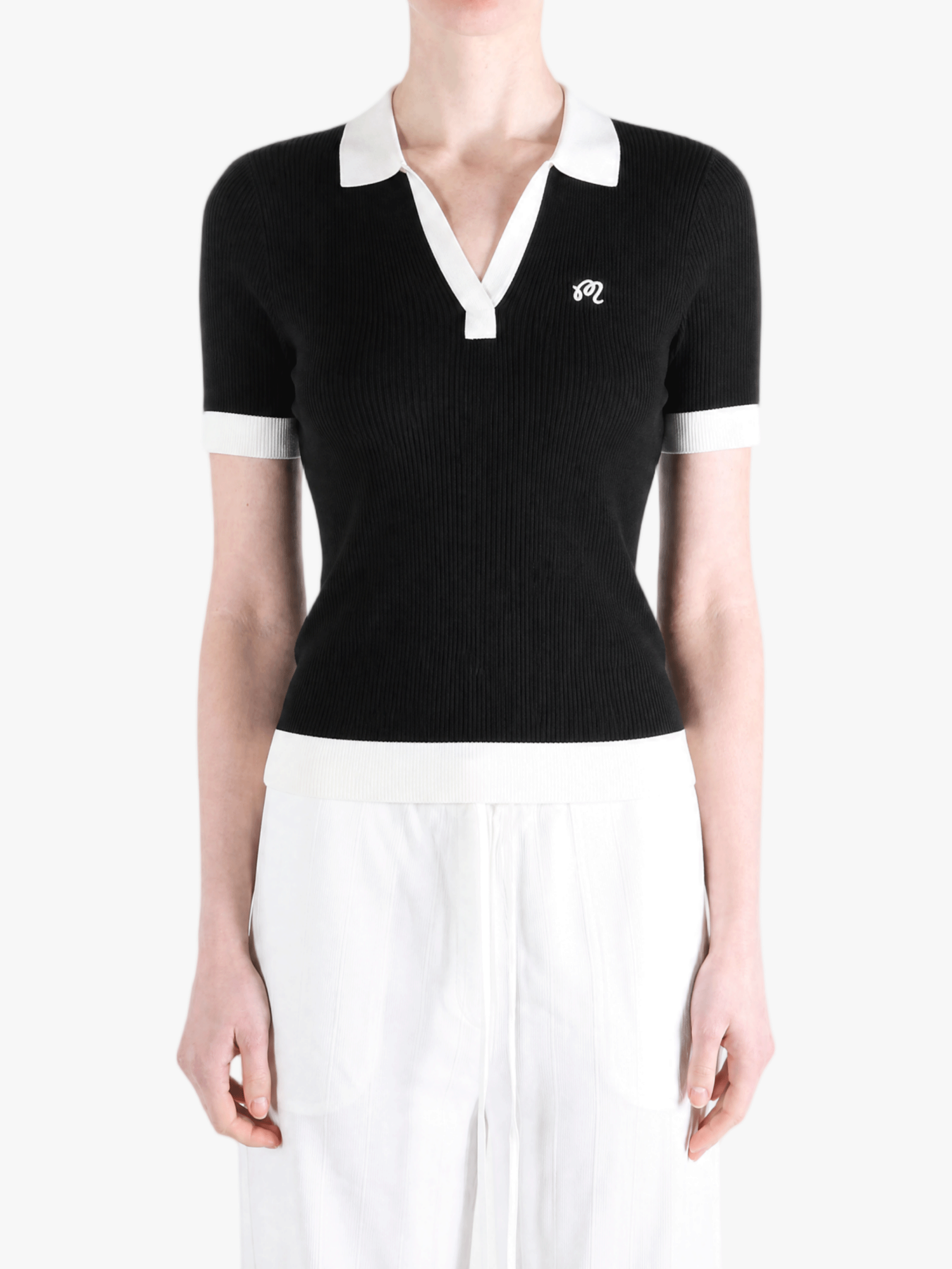 Black shirt worn by a person, showing the shirt fit