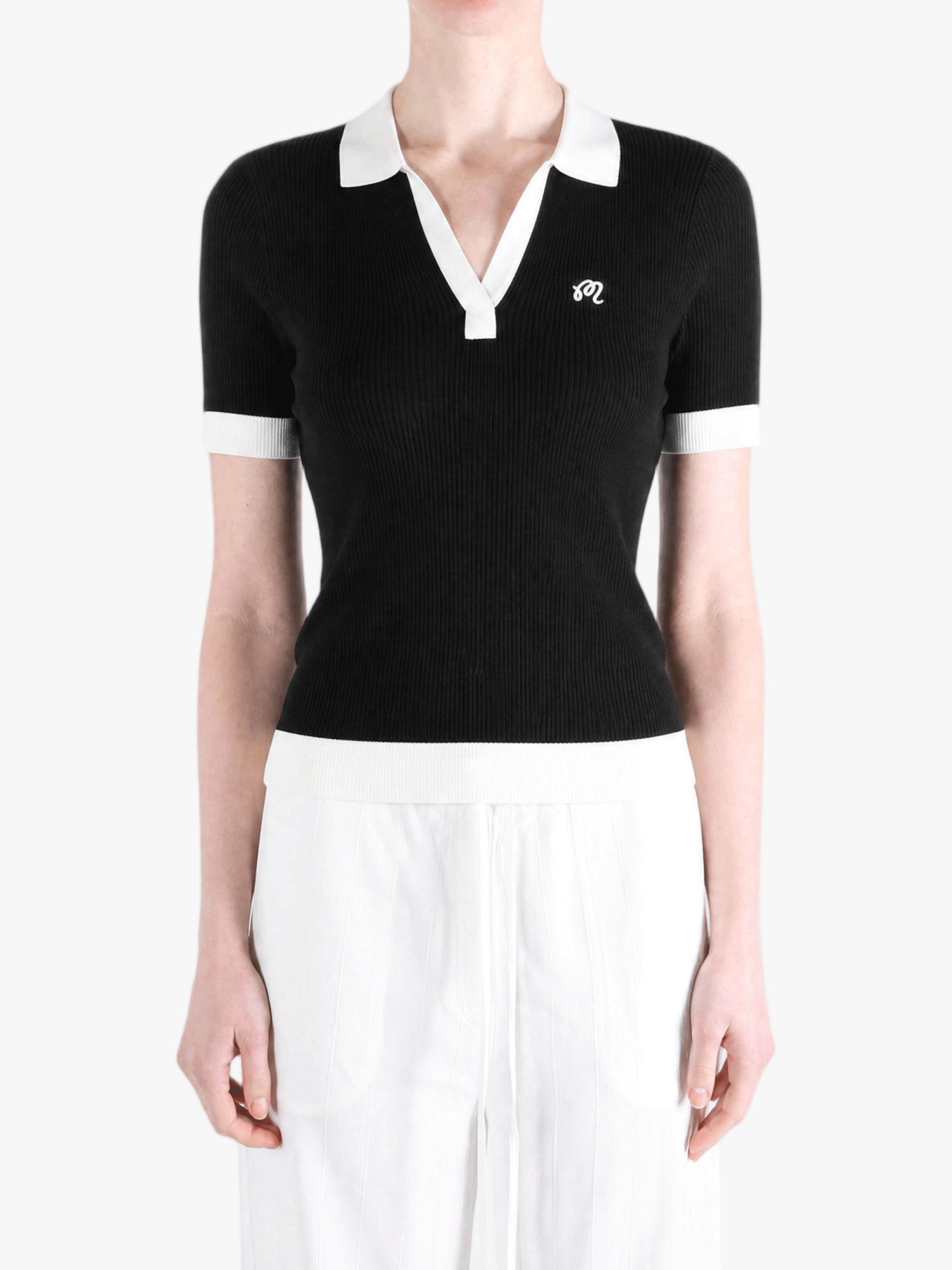Black shirt worn by a person, showing the shirt fit