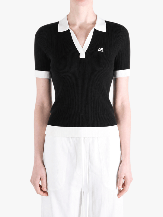 Black shirt worn by a person, showing the shirt fit
