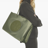 green bag worn by a person, showing the bag fit