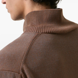 Close up of brown sweater, showing texture of the Cotton fabric