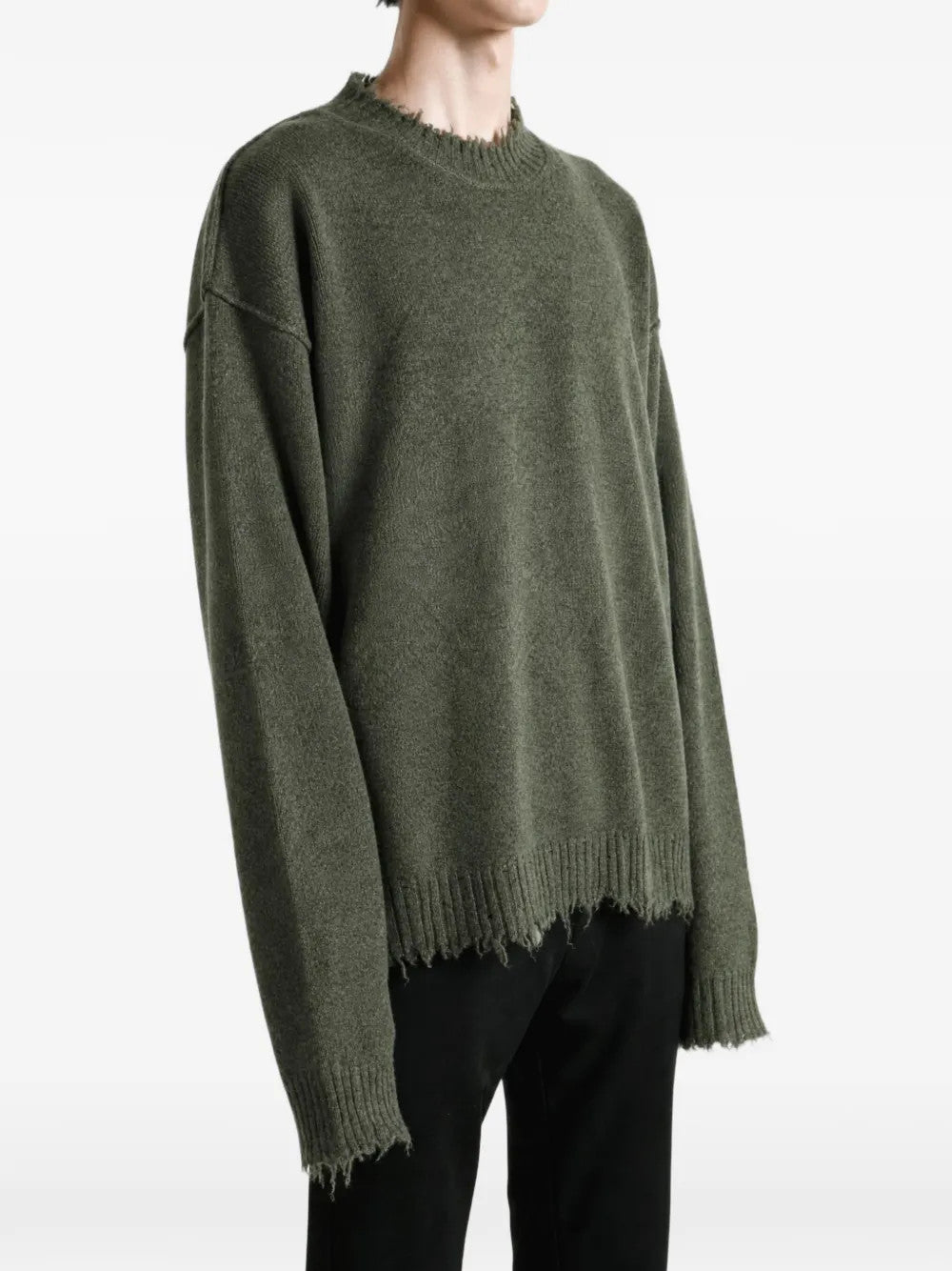 Green top worn by a person, showing the top fit
