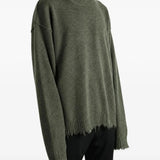 Green top worn by a person, showing the top fit