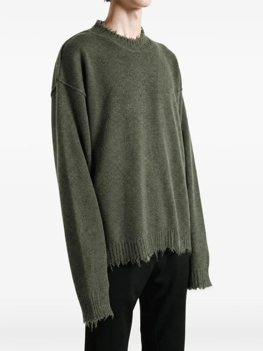 Green top worn by a person, showing the top fit