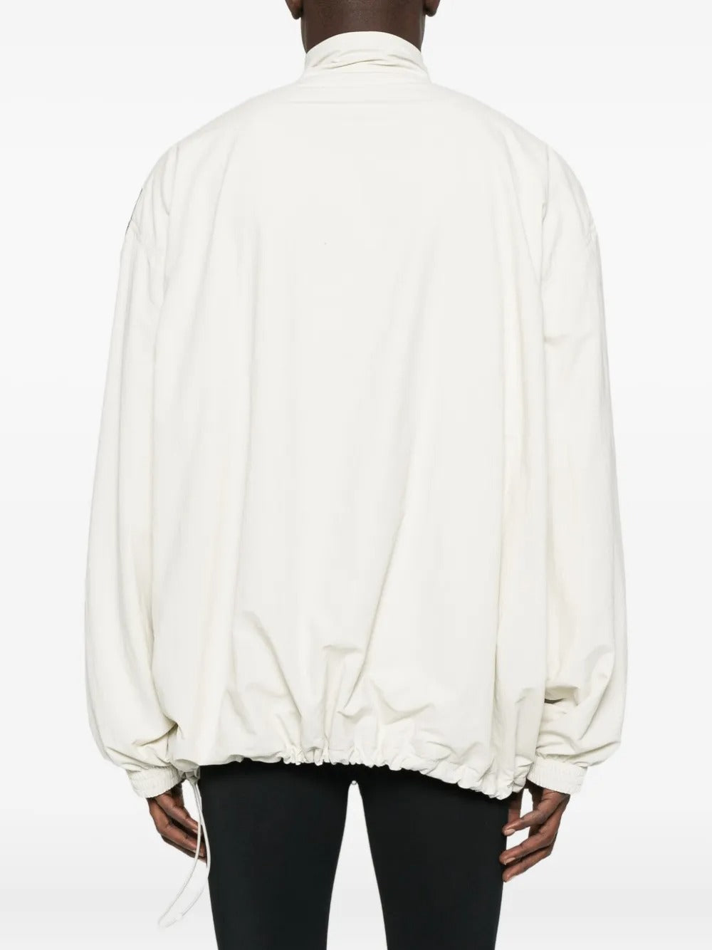 White jacket worn by a person, showing the jacket's fit