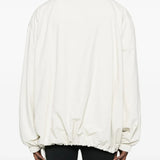 White jacket worn by a person, showing the jacket's fit