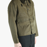 Green jacket worn by a person, showing the jacket fit