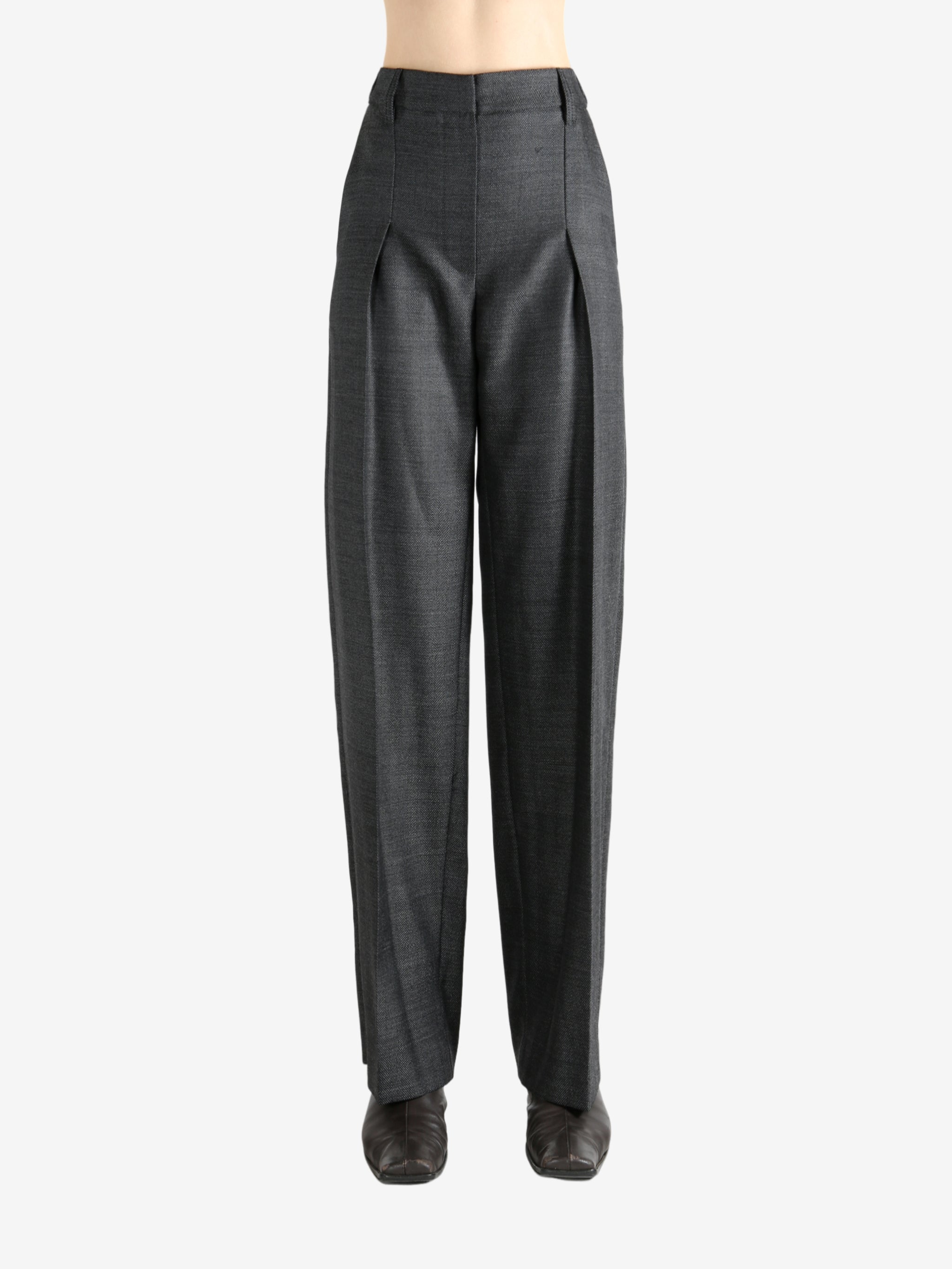 Grey pants worn by a person, showing the pants fit