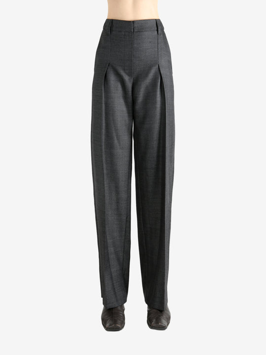 Grey pants worn by a person, showing the pants fit